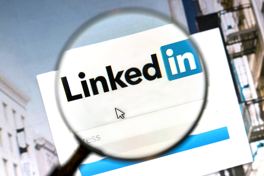 Ostersund, Sweden - August 1, 2015: Linkedin website under a magnifying glass. Linkedin is a business oriented social networking website.